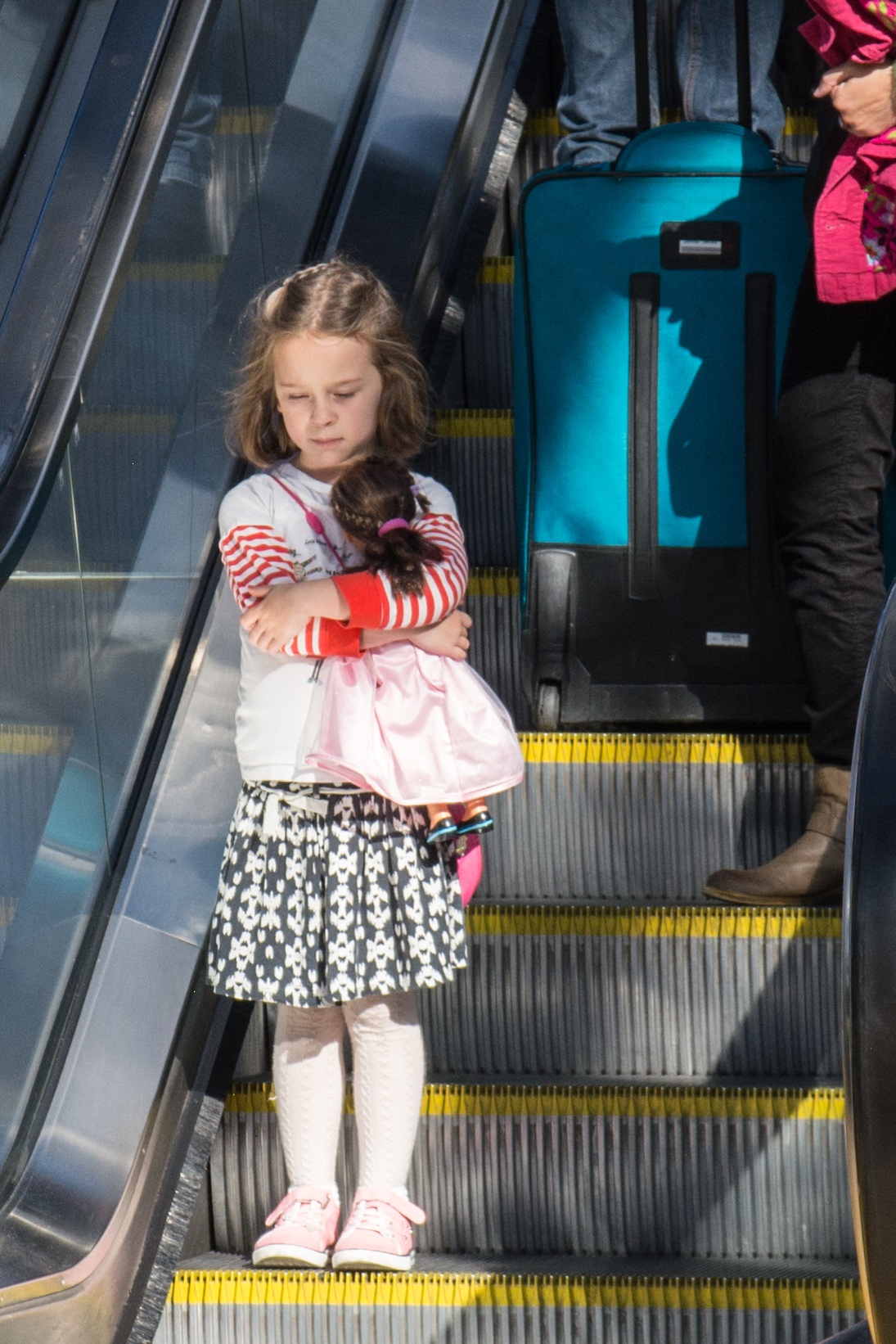 escalator-girl-with-doll
