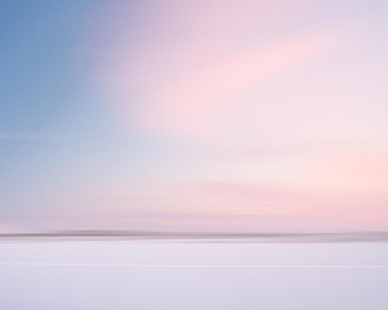 sneeuwvlakte-bij-zonsondergang