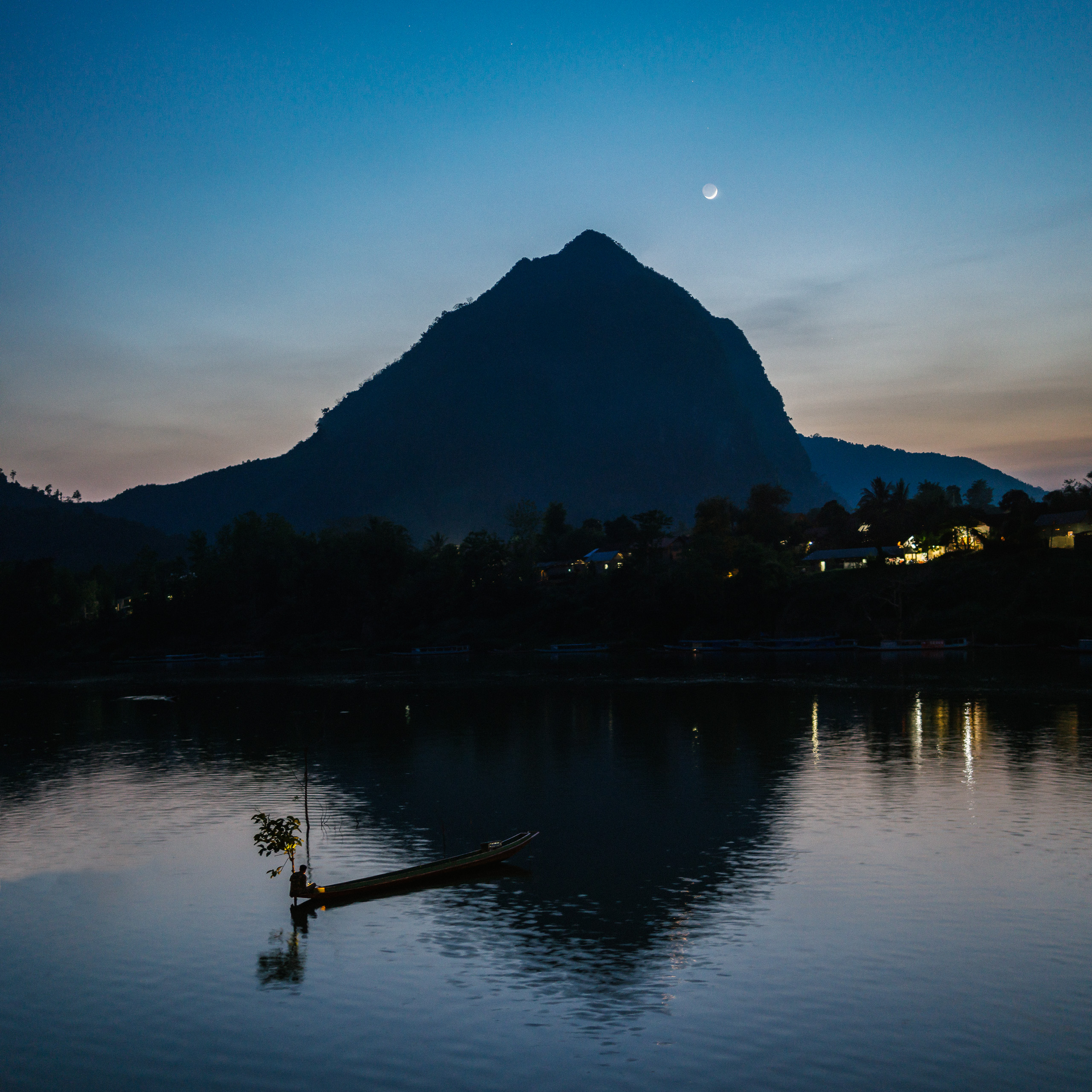 fisherman-during-moonrise-in-laos